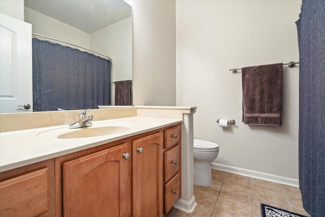 bathroom with visible vents, baseboards, toilet, tile patterned floors, and vanity