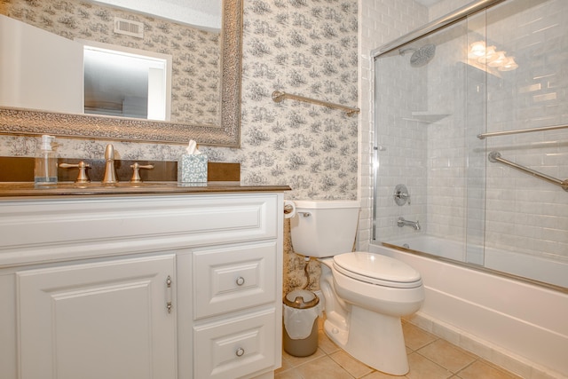 bathroom featuring visible vents, wallpapered walls, toilet, vanity, and tile patterned floors