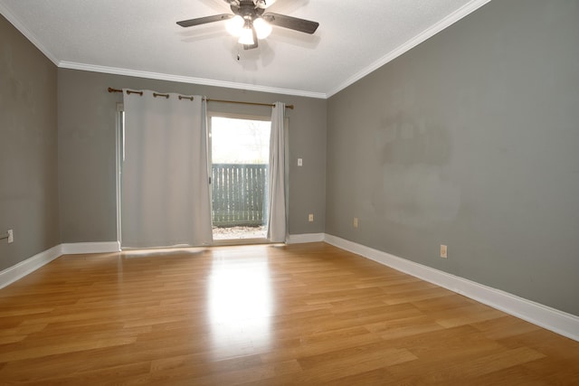 unfurnished room featuring ornamental molding, baseboards, and light wood finished floors