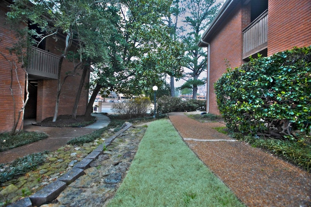 view of yard featuring a balcony