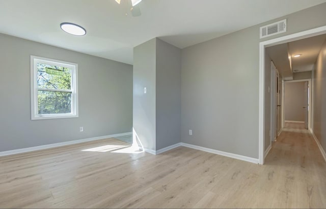 750 Chelsea Dr, Memphis, TN 38107 - unfurnished room with light wood-style floors, visible vents, ceiling fan, and baseboards