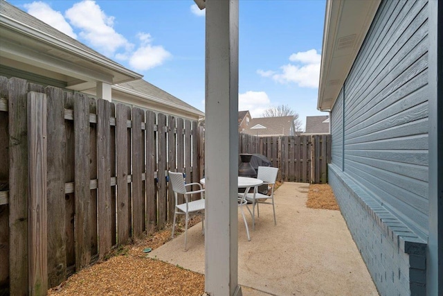 view of patio / terrace featuring a fenced backyard and outdoor dining area