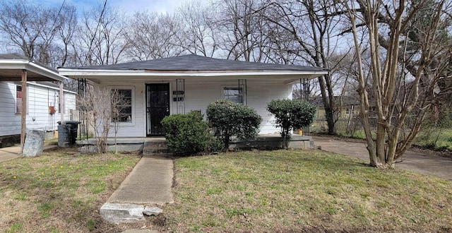 view of front of house featuring covered porch and a front lawn