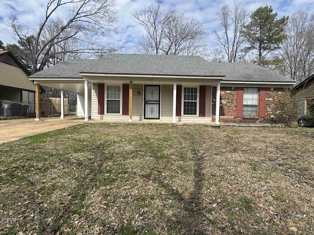 single story home with driveway, covered porch, a front yard, a carport, and brick siding