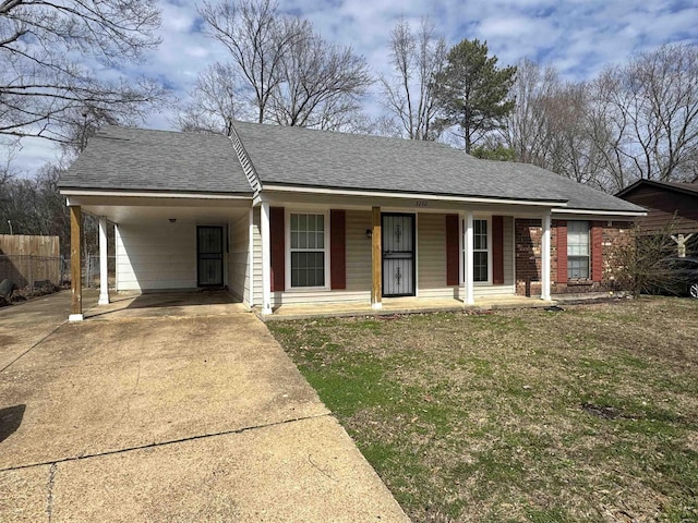 single story home featuring roof with shingles, a porch, fence, a carport, and driveway