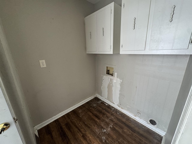 laundry room with dark wood-style flooring, washer hookup, cabinet space, and baseboards