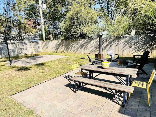 view of patio with a fenced backyard and outdoor dining space