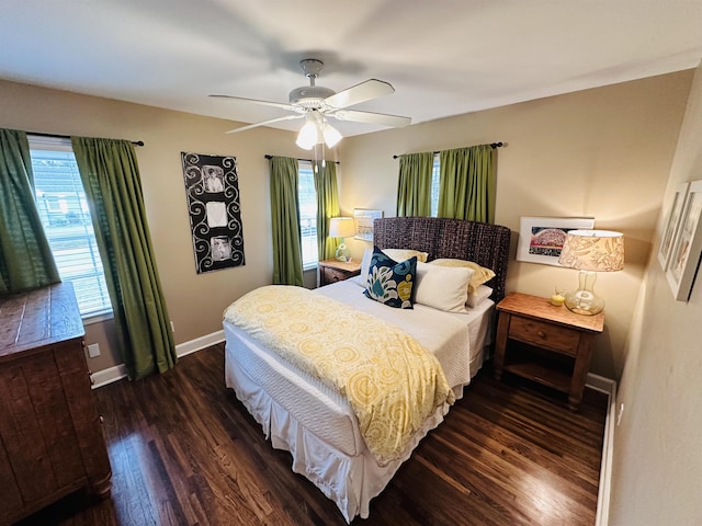 bedroom featuring dark wood-style floors, ceiling fan, and baseboards