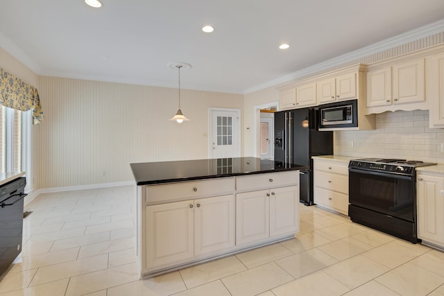 kitchen with crown molding, decorative backsplash, hanging light fixtures, cream cabinetry, and black appliances