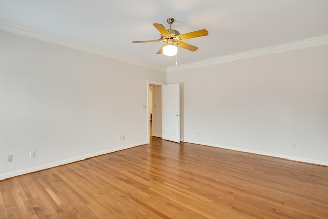 unfurnished room featuring light wood-type flooring, baseboards, a ceiling fan, and crown molding