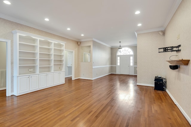 unfurnished living room featuring recessed lighting, baseboards, light wood finished floors, and ornamental molding