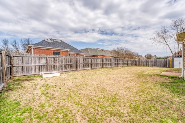 view of yard featuring a fenced backyard