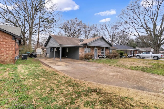 view of front facade with brick siding, central AC, concrete driveway, and a front lawn