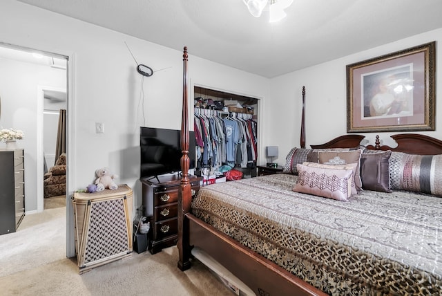 carpeted bedroom with a closet and ceiling fan