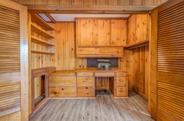 unfurnished office featuring a sauna and light wood-style flooring