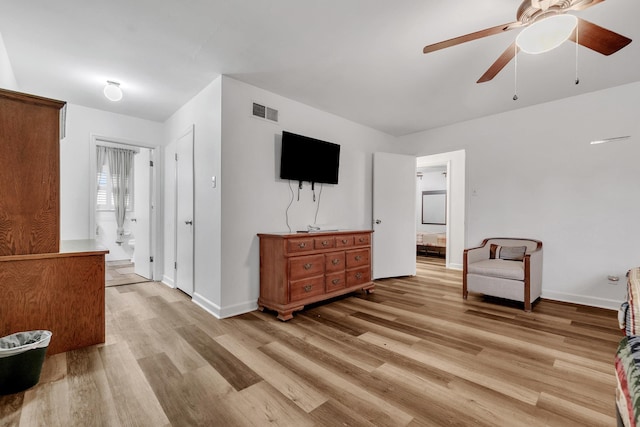 interior space with visible vents, light wood-style floors, and ensuite bath