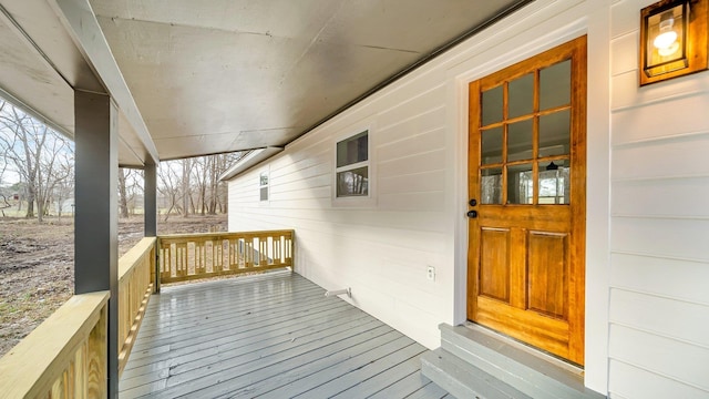 wooden deck featuring covered porch