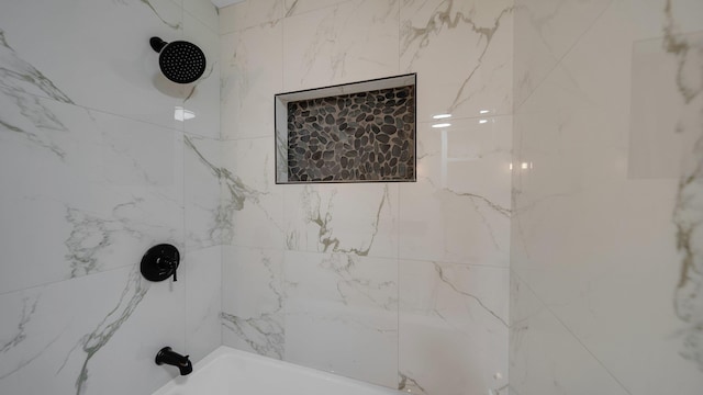 details featuring shower / bath combination