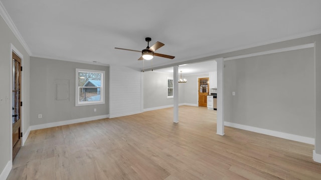 unfurnished living room with baseboards, light wood-style floors, crown molding, and ceiling fan with notable chandelier