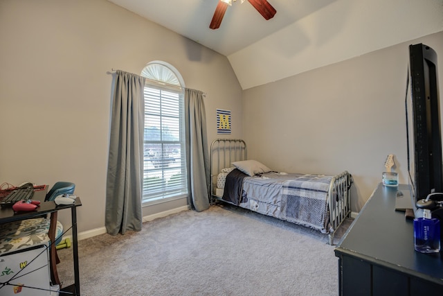 carpeted bedroom with baseboards, lofted ceiling, and a ceiling fan