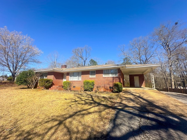 ranch-style house with brick siding, a carport, a chimney, crawl space, and driveway