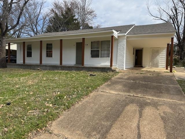 single story home featuring brick siding, covered porch, concrete driveway, and a front lawn