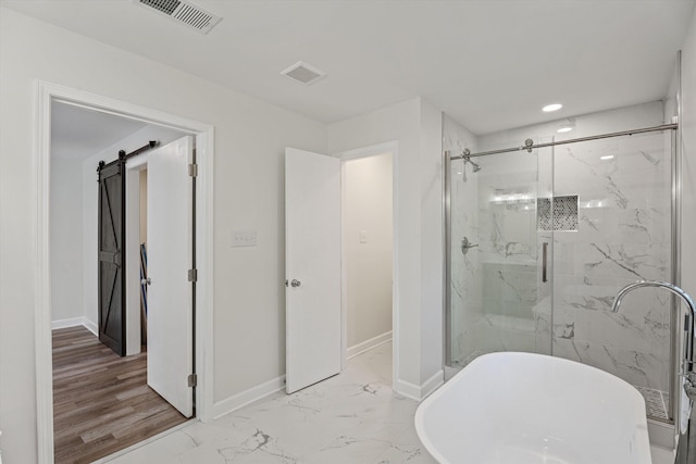 bathroom featuring a marble finish shower, visible vents, baseboards, a freestanding bath, and marble finish floor