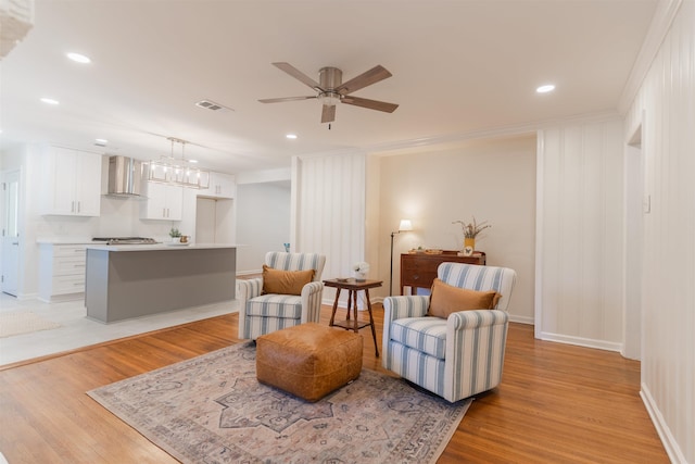 sitting room with recessed lighting, a ceiling fan, visible vents, and light wood finished floors