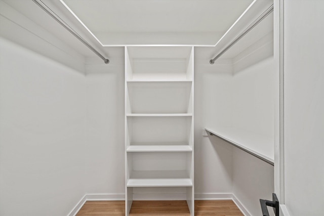 spacious closet with wood finished floors