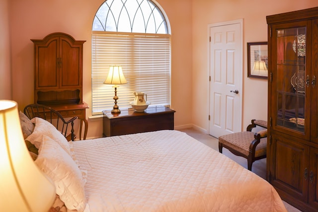 carpeted bedroom with baseboards