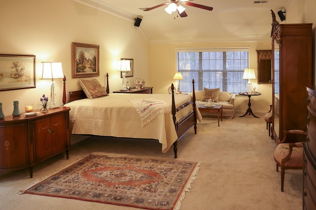 bedroom with visible vents, a ceiling fan, crown molding, light colored carpet, and vaulted ceiling