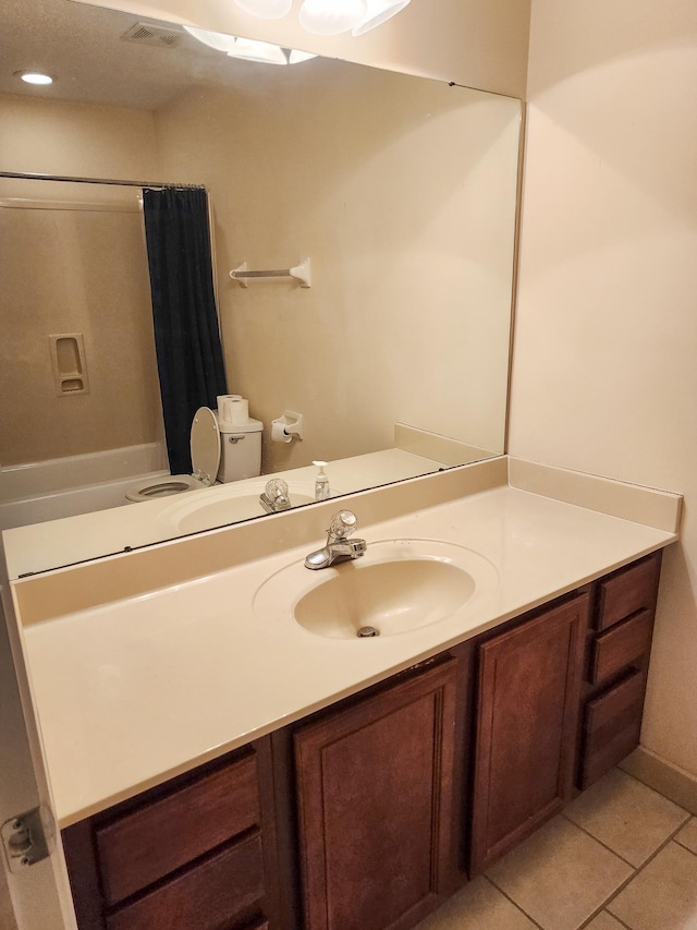 full bathroom featuring visible vents, vanity, and tile patterned flooring