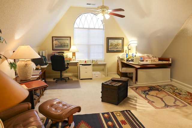 home office with a ceiling fan, baseboards, lofted ceiling, a textured ceiling, and carpet flooring