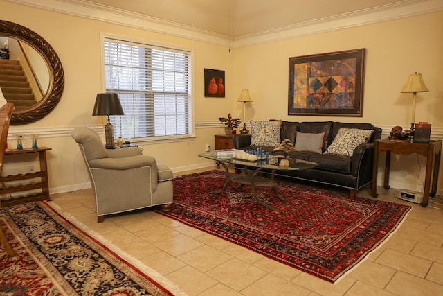 living area featuring baseboards, crown molding, and tile patterned flooring