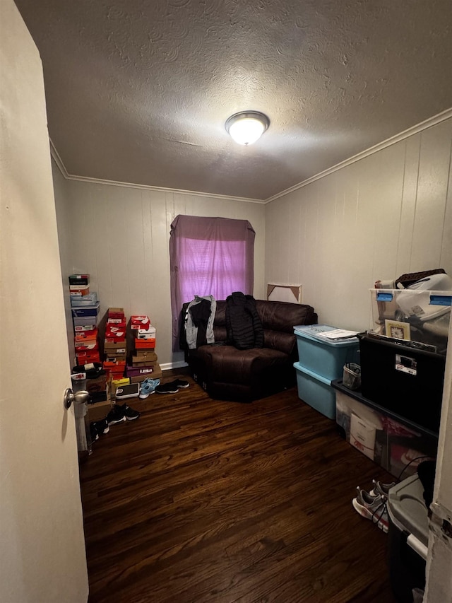 office area with crown molding, wood finished floors, and a textured ceiling