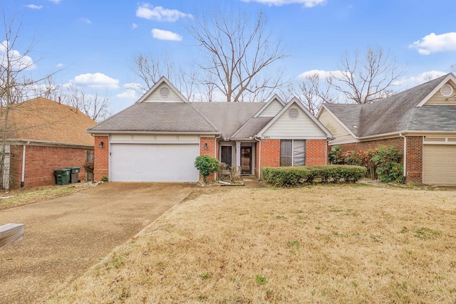 ranch-style house featuring brick siding, driveway, an attached garage, and a front lawn