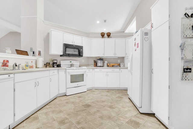 kitchen featuring white cabinets, white appliances, light countertops, and a sink