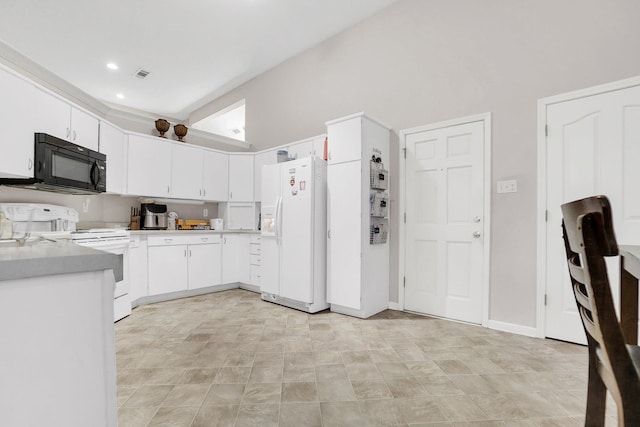 kitchen featuring white cabinetry, white appliances, light countertops, and visible vents