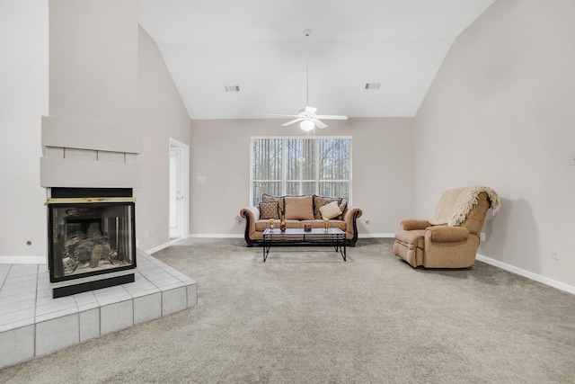 carpeted living room with visible vents, a fireplace, and baseboards