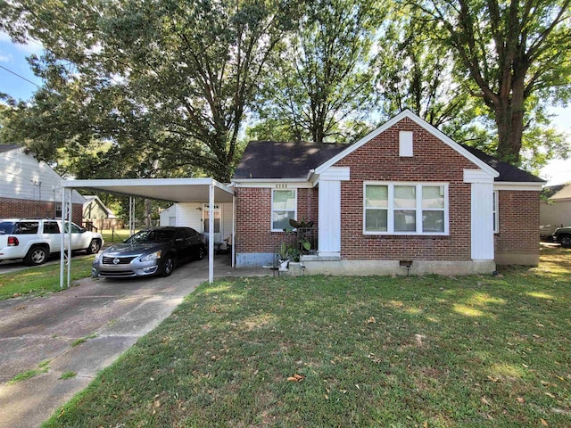 view of front of home with a carport, brick siding, concrete driveway, and a front lawn