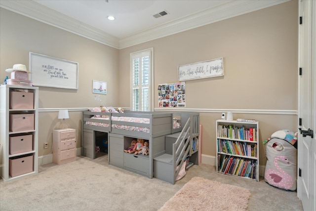 bedroom featuring visible vents, baseboards, ornamental molding, and carpet flooring