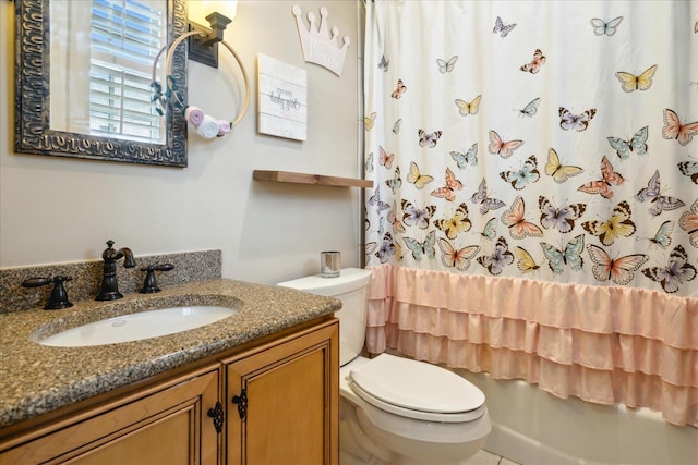 full bathroom featuring toilet, vanity, and shower / tub combo