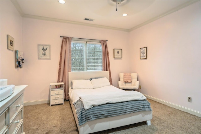 bedroom featuring baseboards, light colored carpet, visible vents, and ornamental molding