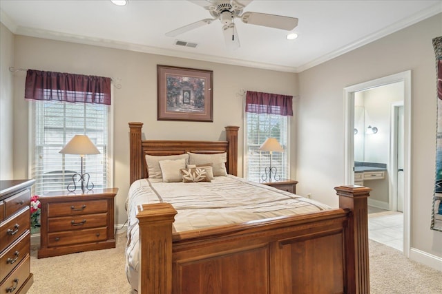 bedroom with visible vents, recessed lighting, ornamental molding, ensuite bathroom, and light colored carpet