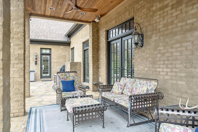 view of patio with an outdoor living space and ceiling fan