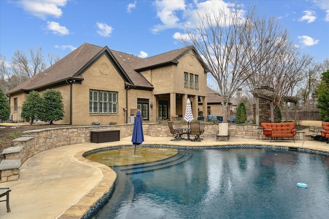 view of swimming pool featuring a fenced in pool, a patio, and fence