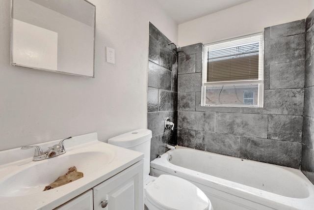 full bathroom featuring toilet, vanity, and bathing tub / shower combination