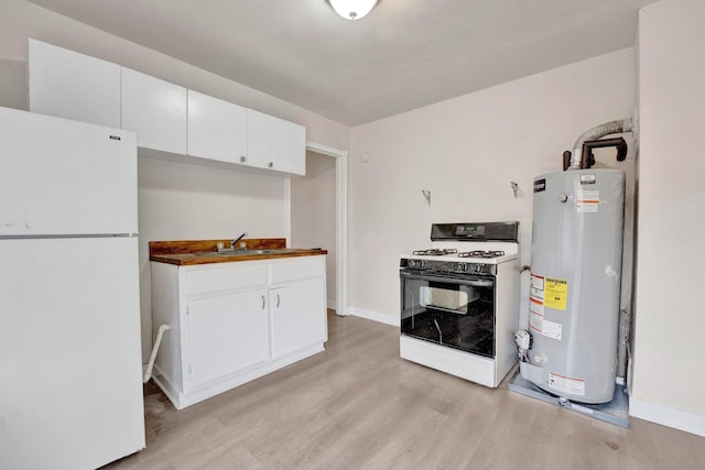 kitchen with light wood-style flooring, a sink, gas water heater, white appliances, and white cabinets