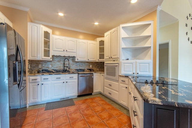 kitchen with refrigerator with ice dispenser, a sink, white cabinets, white oven, and dishwasher