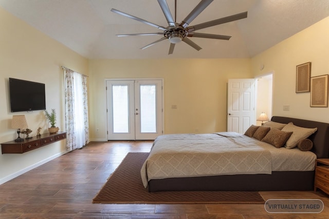 bedroom featuring access to exterior, baseboards, vaulted ceiling, french doors, and wood finished floors